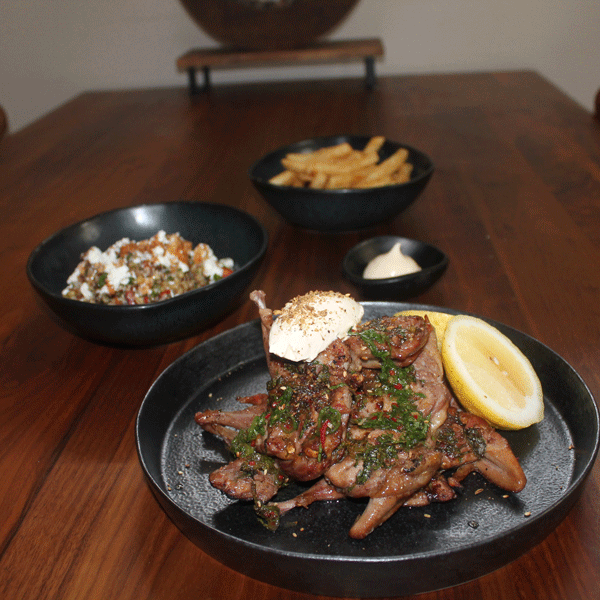 Spiced smoked quail with grain salad